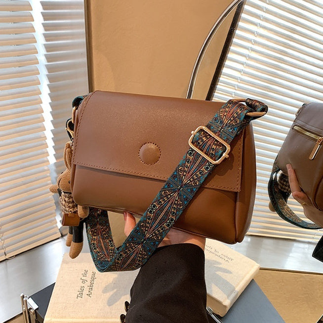 Versatile Small Square Bag With A Wide Shoulder Strap For Crossbody Wear